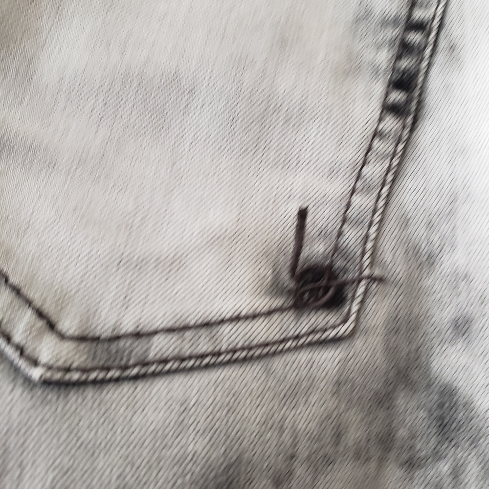 Bebe cloudy acid wash jeans with pockets and ankle zipper detail